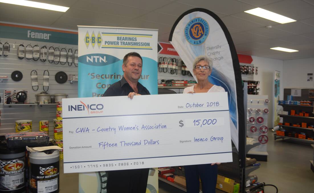 Welcome donation: CBC Dubbo branch manger Chris Anderson presents the $15,000 cheque to CWA NSW Macquarie group president Karen McHale. Photos: Taylor Jurd