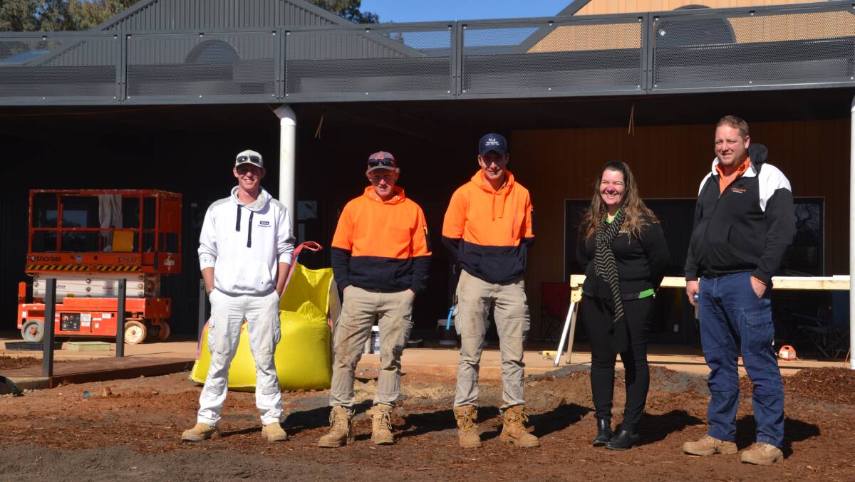 The finishing touches are being done at Wellingtons Maranatha Gunyah with Damian Hunter, Tom Swainston, Will Jameson, Dixie Robinson and Will Redfern at the centre. Photo: Supplied 