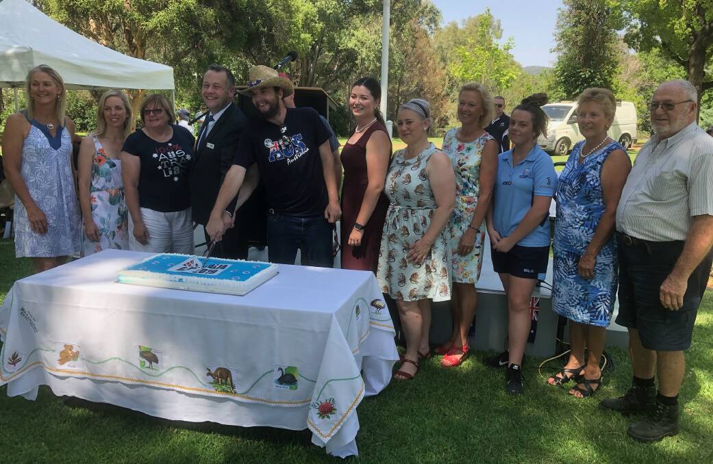 Entries open: The 2019 Australia Day award winners cut the celebratory cake alongside the Ambassador and mayor Ben Shields. Photo: File.