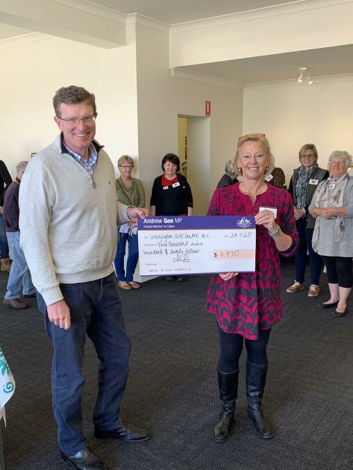 President of the Wellington Arts Society Lisa Thomas accepts the grant fundng cheque from Calara MP Andrew Gee. Photo: Supplied 