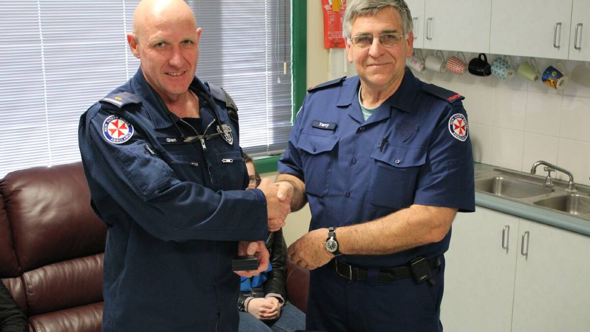 Station officer Glen Flanagan presenting Medals of service to, Right Terry Melhuish VAO. Photo: Supplied.