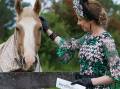 Fashionista: Kate Lynch was named as the best dressed touch of green winner in the online Fashion on the Field competition. Photo: Supplied.