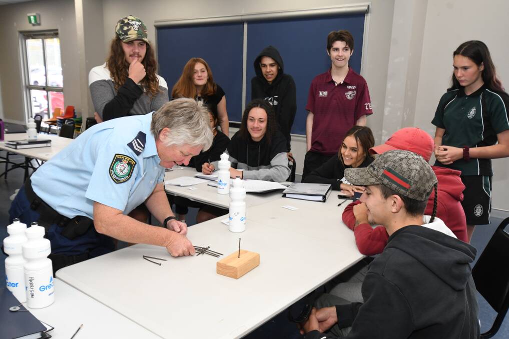 TEAMWORK: Senior Constable Helen Baker conducts a Fit For Work lesson at Orange. Photo: JUDE KEOGH