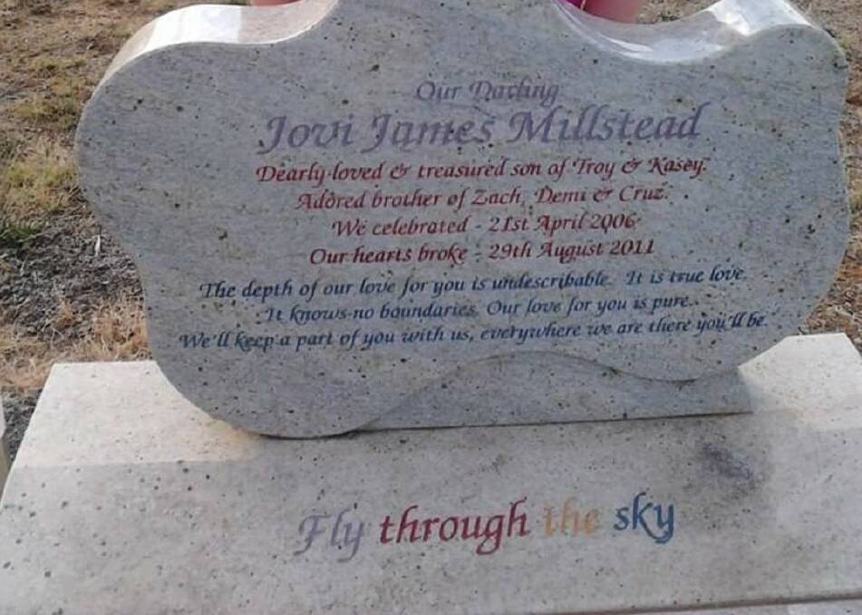 The gravestone of Jovi Millstead, decorated in The Wiggles colours.