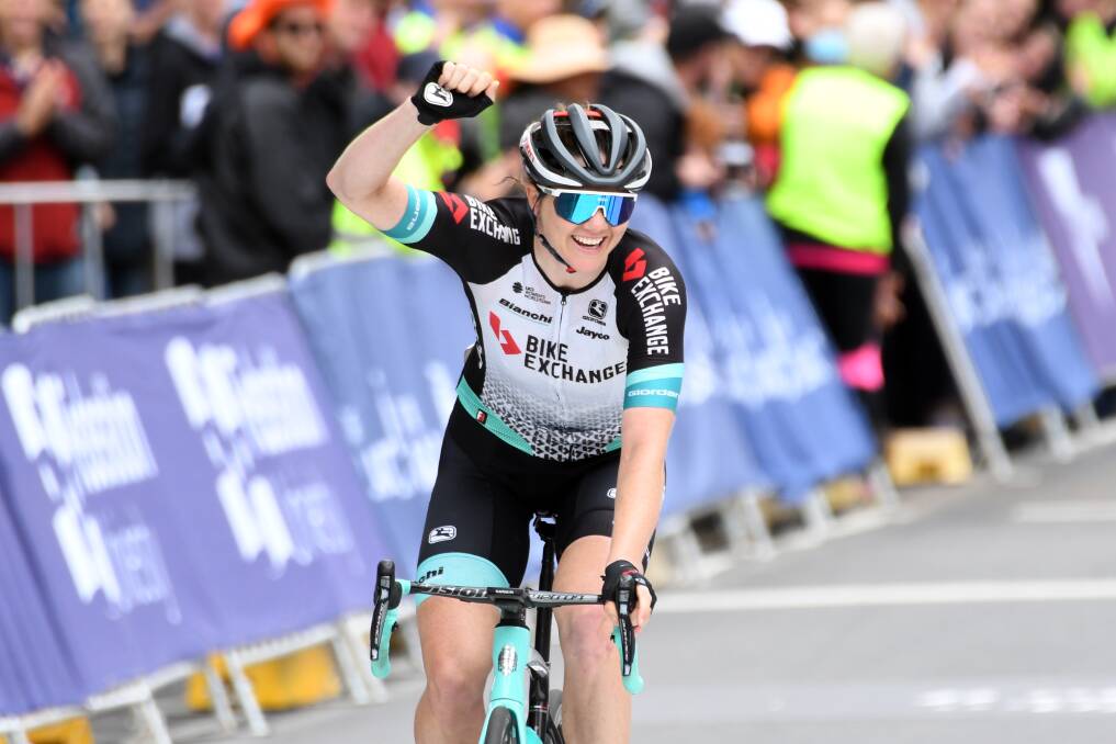 Champion: Sarah Roy celebrates as she wins the elite women's road race. Picture: Kate Healy