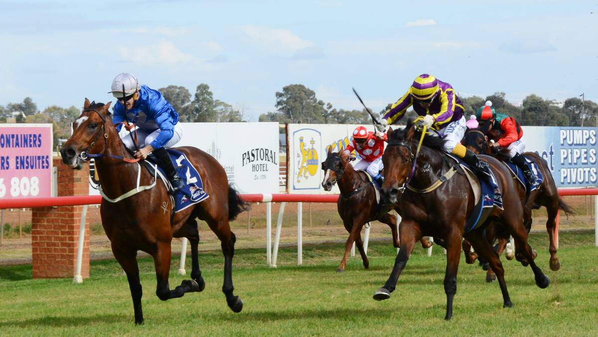 A BIG RESULT: Travis Wolfgram and trainer Todd Howlett combined to give Big Reg a win on debut at Dubbo Turf Club. Photo: BELINDA SOOLE