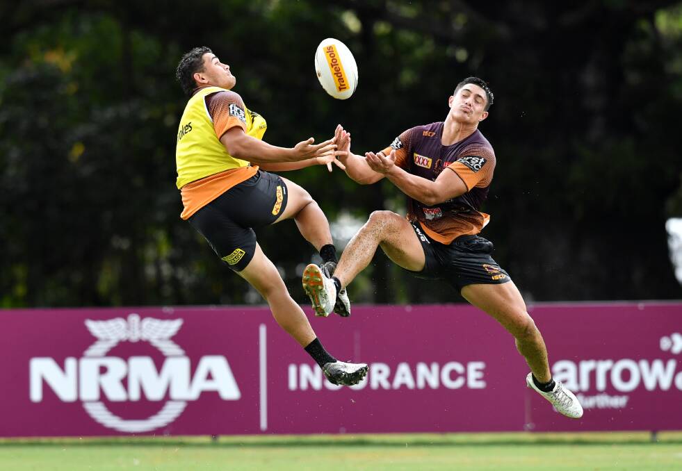 TAKING THE LEAP: Kotoni Staggs (right) has impressed with his versatility during his short time in the NRL. Photo: AAP/DARREN ENGLAND