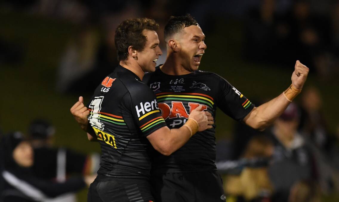 SPECIAL: Wellington junior Brent Naden (right) celebrates the Panthers' opening try with fullback Dylan Edwards on Thursday night. Photo: AAP