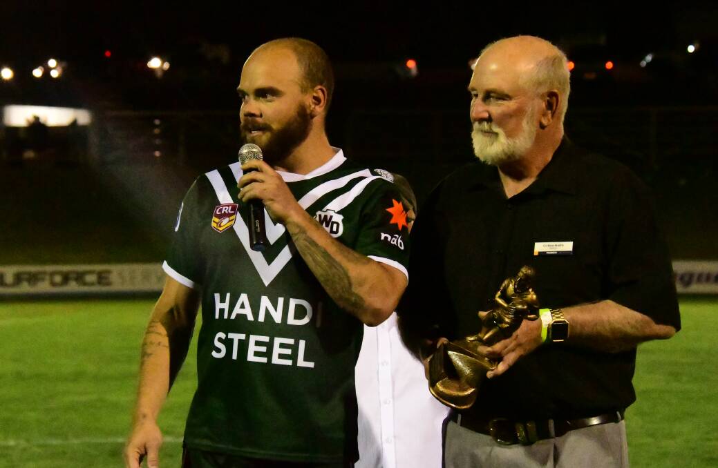 HONOUR: Aidan Ryan speaks the the crowd after being presented Western's man of the match award by Parkes Shire Council mayor, Ken Keith. Photo: NICK GUTHRIE
