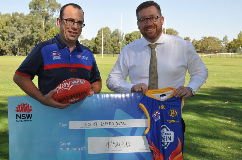 Thank You: Nick Lowther at Dubbo’s South Dubbo Oval was more than happy to accept the more than $15k grant for the club presented by Troy Grant. Photo: CONTRIBUTED
