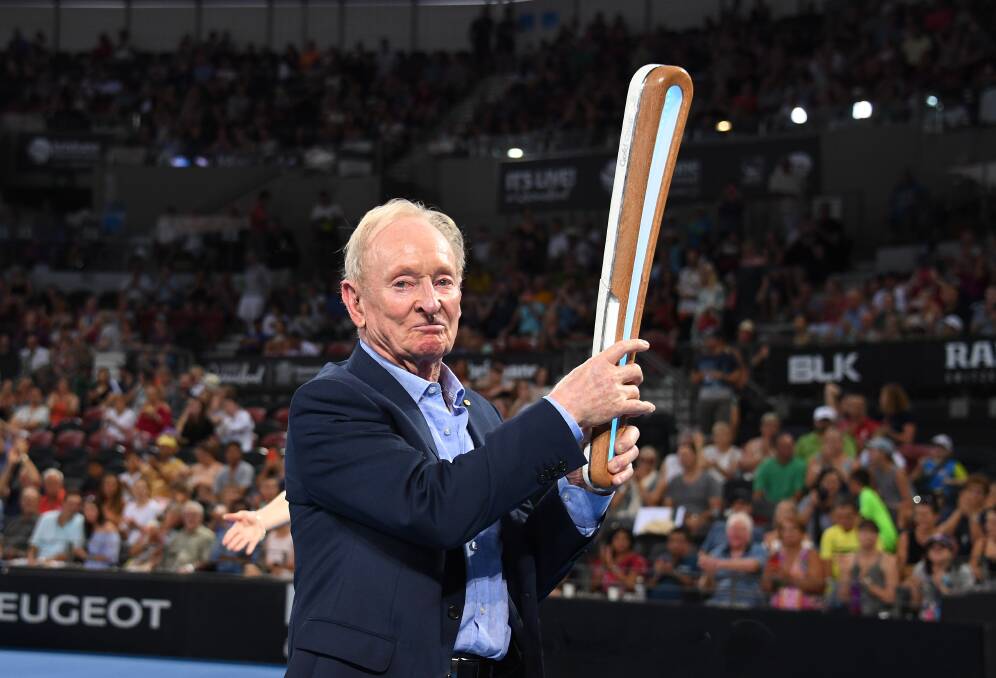 Tennis legend Rod Laver with the Commonwealth Games Queen's Baton. Photo: AAP