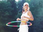 HAPPY HOOPER: Hula hooping for fitness is trending and is the go-to for the likes of Michelle Obama and Beyonce. Picture: Shutterstock.