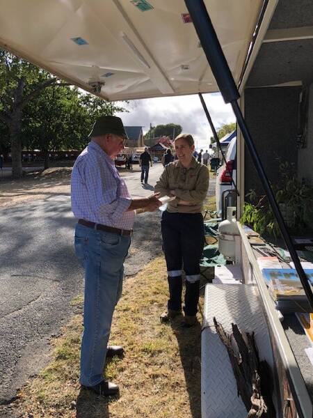 Threatened species officer Dr Sarah Bell talks to a community member about the regent honeyeater at an event in the Kandos-Rylstone area. Photo contributed.