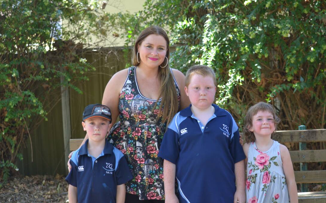 Struggling: Aged and community care worker Lisa Rowney with her children Jack, Cooper and Jade. Photo: Daniel Shirkie.