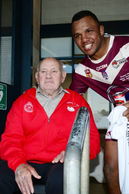 Honoured: Travis Waddell after being presented with the Bob Weir trophy by Group 11 legend Bob Weir. Photo: Belinda Soole.