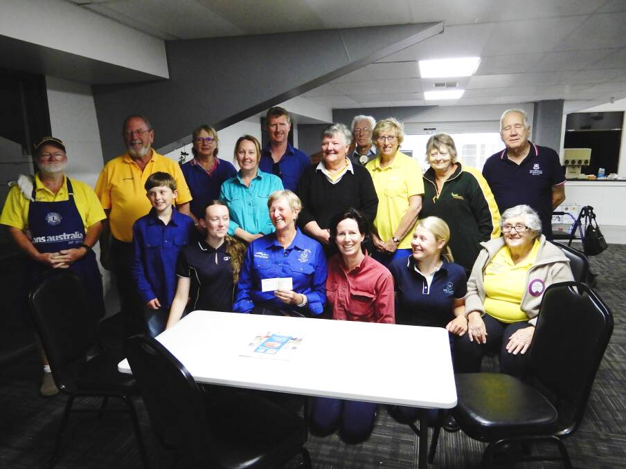 Sue-Ellen Lovett and guides, surrounded by members of the Wellington Lion's Club. Photo: Chris Hardy.
