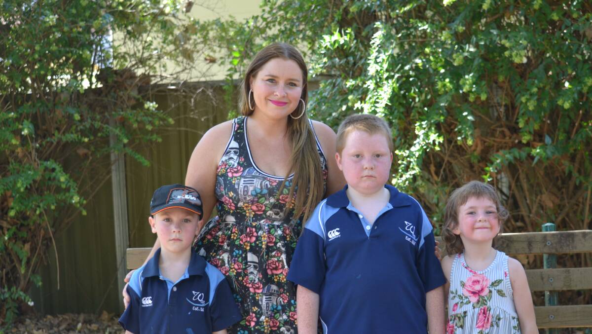 Aged and community care worker Lisa Rowney with her children Jack, Cooper and Jade. Photo: Daniel Shirkie.