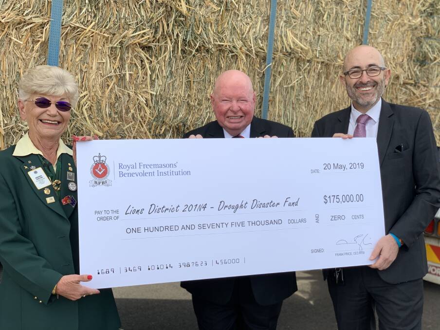 Windfall: Anne Jones, Douglas James and Frank Price during the cheque handover at the RFBI Masonic Village in Dubbo. Photo: Supplied. 
