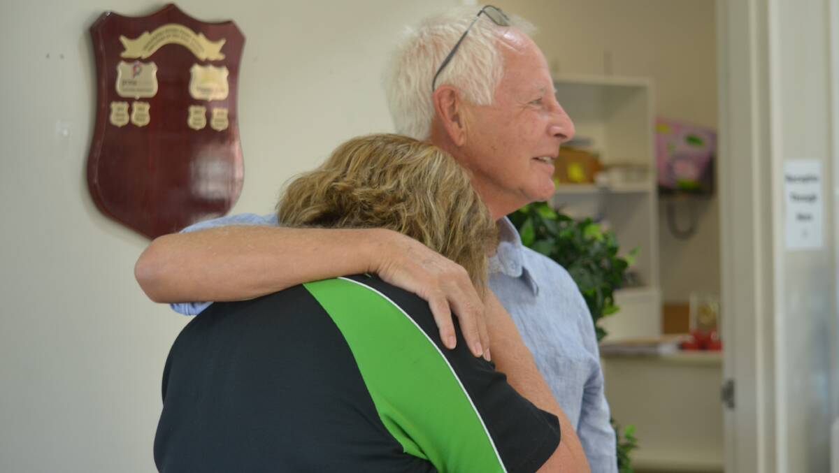 Maranatha Vice President Terry Frost comforts CEO Debra Matheson after the funding grant was announced. Photo: Daniel Shirkie.