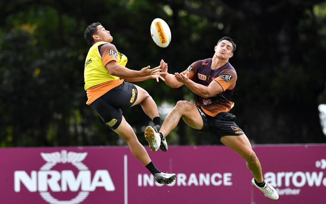 TAKING THE LEAP: Kotoni Staggs (right) has impressed with his versatility during his short time in the NRL. Photo: AAP/DARREN ENGLAND