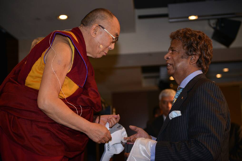 The Dalai Lama meets Kamahl.