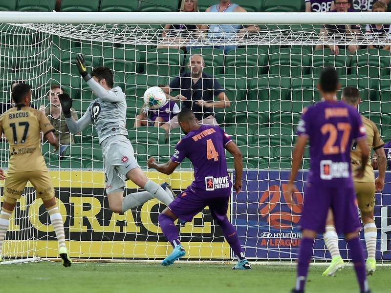 Gregory Wuthrich (4) heads home Perth Glory's opener against Western Sydney Wanderers.