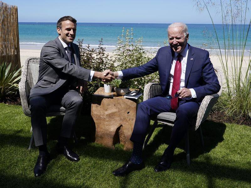 Joe Biden and Emmanuel Macron talk during a bilateral meeting at the G7 summit in England.