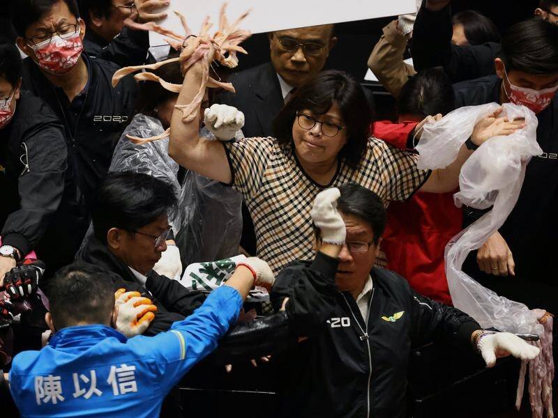 Pork intestines have been thrown amid rowdy protests in Taiwan's parliament.