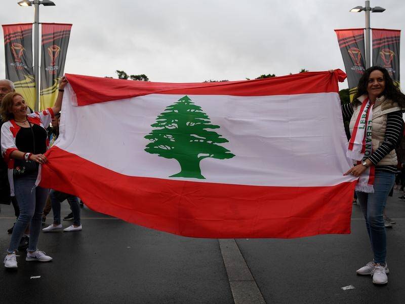 Lebanon supporters proudly display their country's national flag at the 2017 Rugby League World Cup.