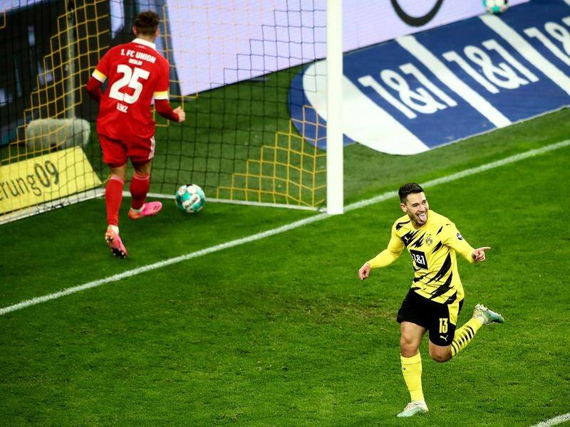 Dortmund's Raphael Guerreiro celebrating his late goal that sealed a big 2-0 win over Union Berlin.