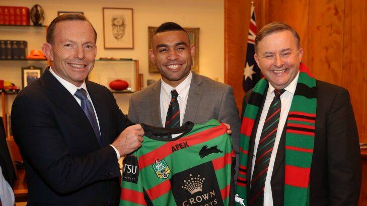 Prime Minister Tony Abbott was presented with a South Sydney NRL jersey by Nathan Merritt and ALP shadow minister and Bunnies tragic Anthony Albanese in his Parliament House suite in Canberra on Thursday 2 October 2014. Photo: Andrew Meares Embargoed to print edition Fri 3 Oct.
