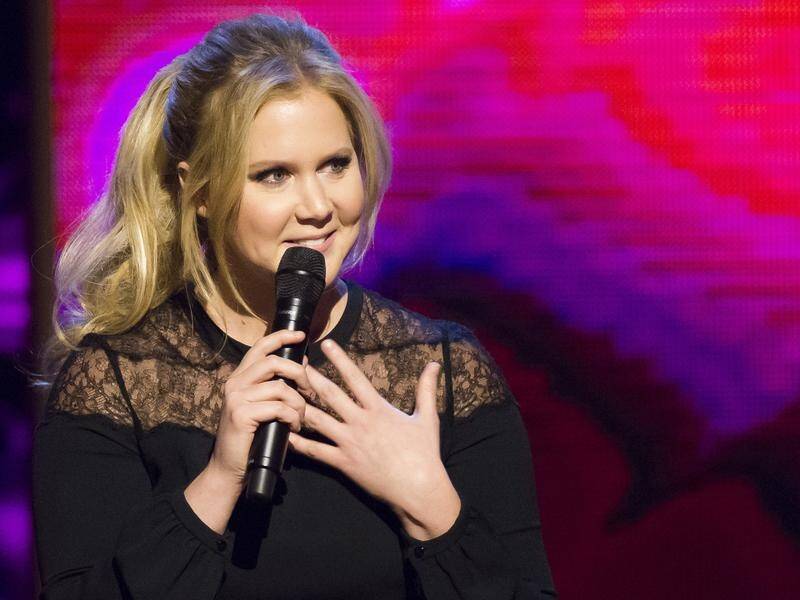 'I am in the hospital. I'm fine. Baby's fine,' Amy Schumer said on Instagram.