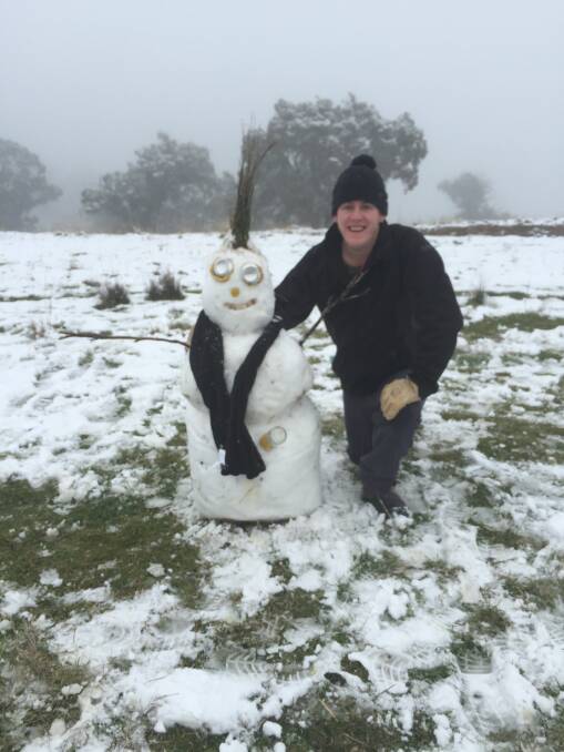 21 year-old Blake Skelly with the Skelly family snowman.