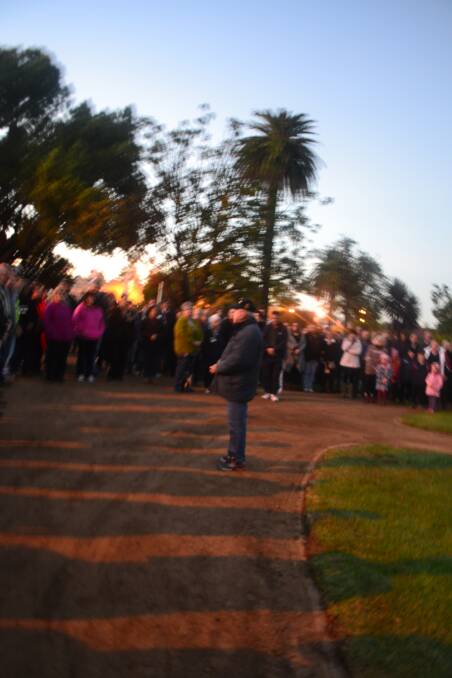 Peter Dowell talks to the crowd at dawn in Wellington