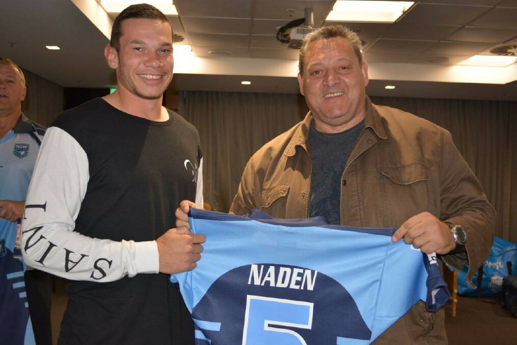 Brent Naden being presented with his jersey by Blocka Roach.