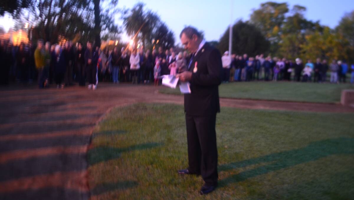 Roy Holmes talks to the big crowd at Wellington's dawn service