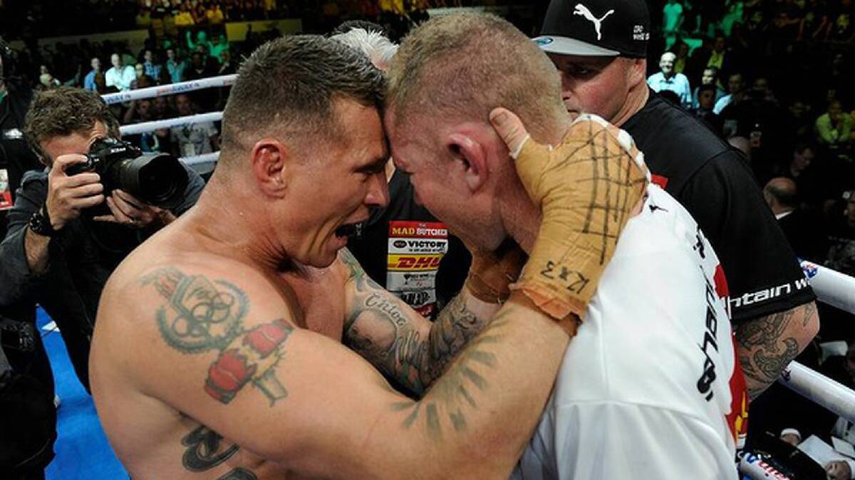 Danny Green consoles Shane Cameron after the fight. Photo: Justin McManus